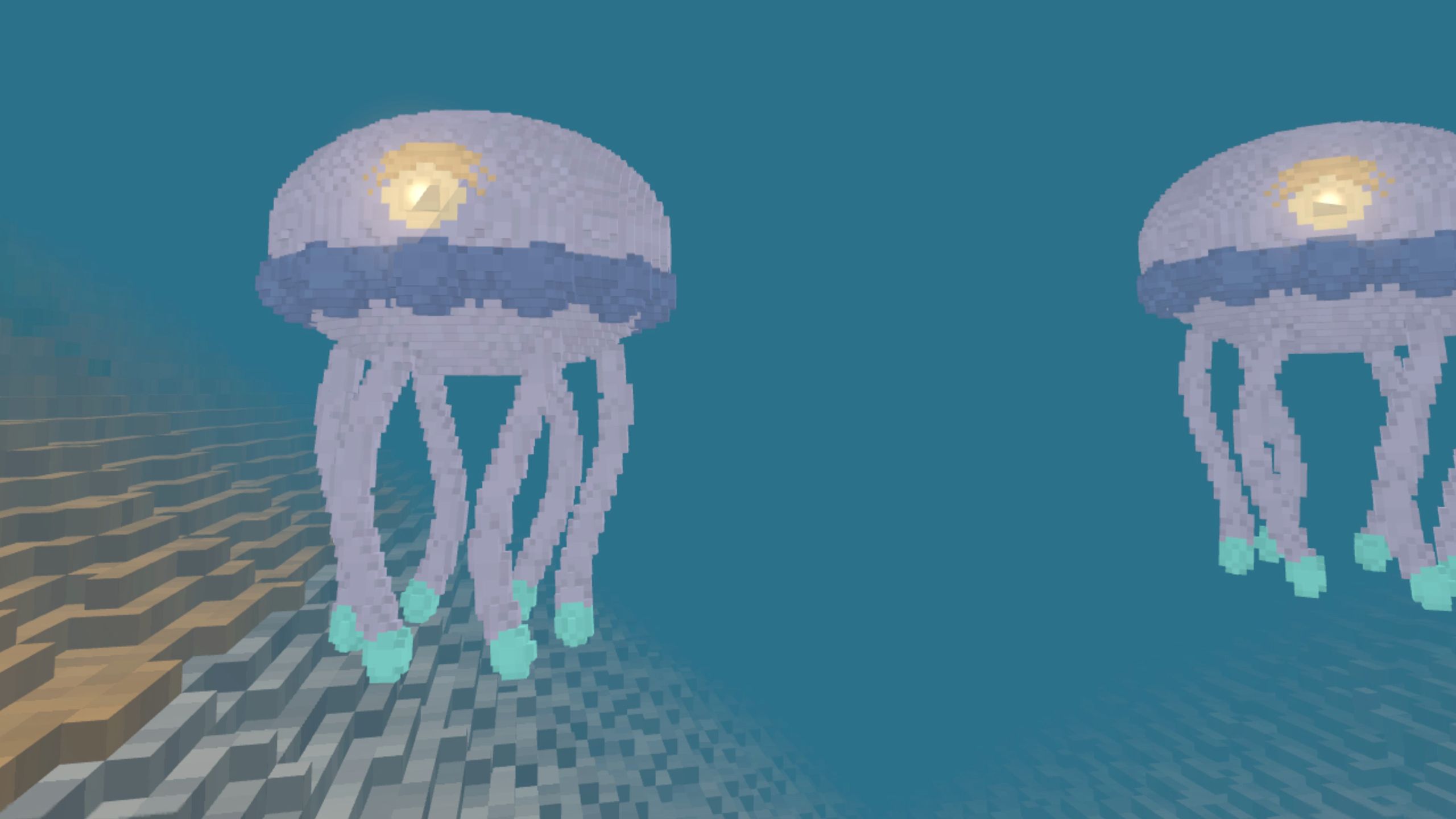 Two glowing lantern jellies drifting over the lake bed