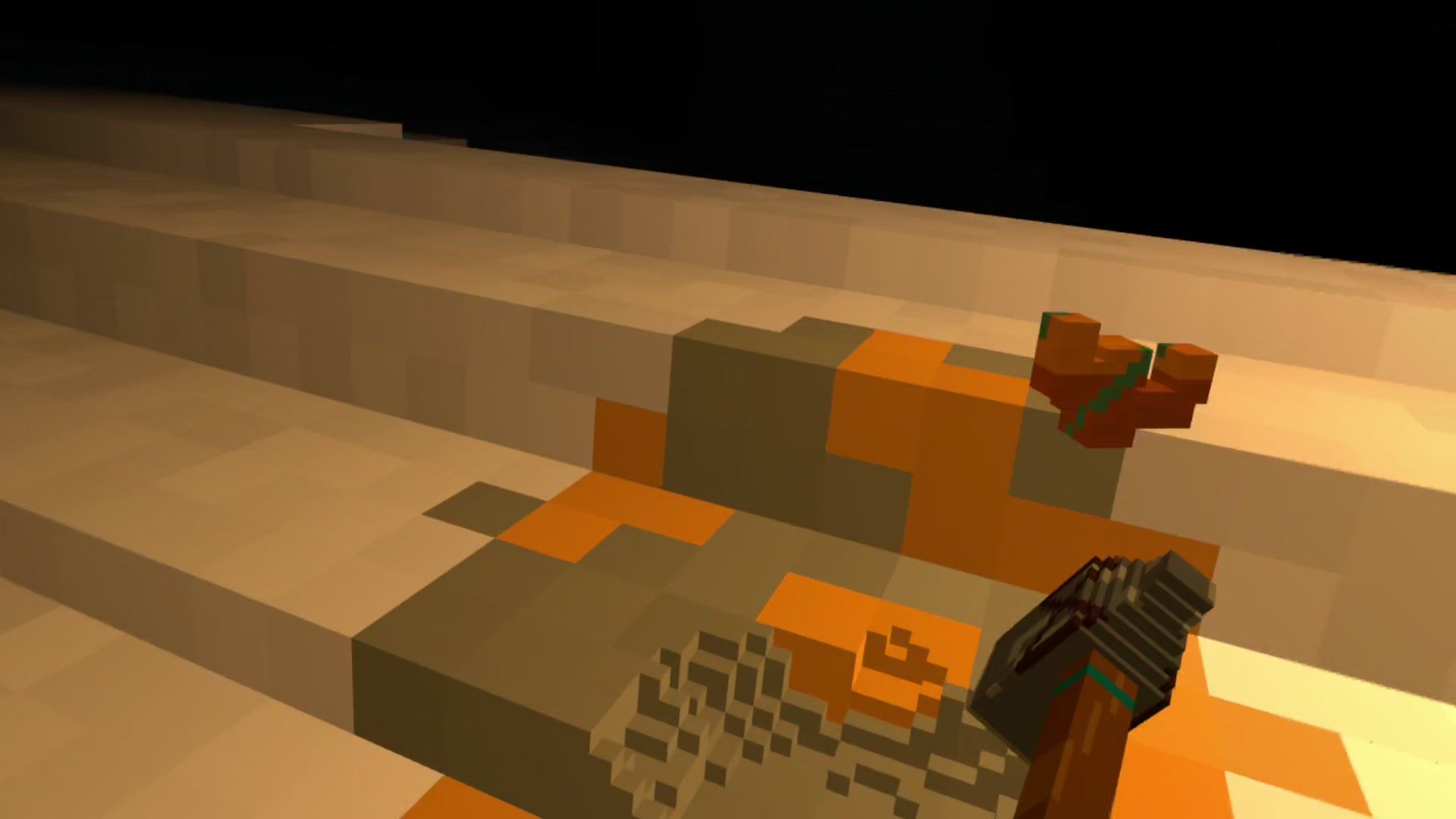 A maul breaking copper ore out of sandstone in a dark, torch-lit cave